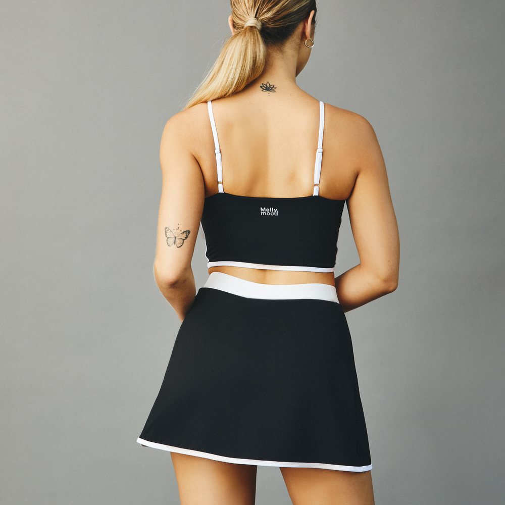 
                      
                        Falda Deportiva Negro con Shorts Integrados
                      
                    